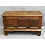An 18thC. oak coffer with candle box, 47.75in wide