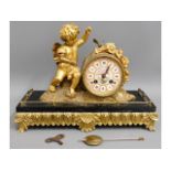 A 19thC. French figurative gilt bronze clock with Sevres style porcelain dial, 13.25in wide x 5in de