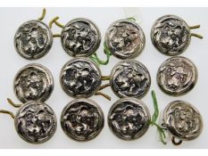 Twelve Edwardian Birmingham silver buttons depicti