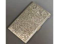 An .800 silver cigarette case with chased decor in