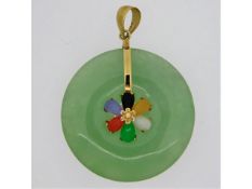 A 9ct gold mounted 30mm diameter jade pendant set