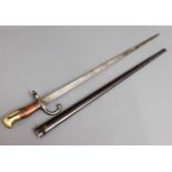 A French 19thC. bayonet & scabbard, 26in long