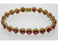 A 9ct gold bracelet set with twenty one Madagascan