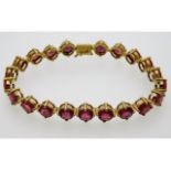 A 9ct gold bracelet set with twenty one Madagascan