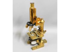 A brass Ross of London "Eclipse" microscope with E. Leitz lens, believed to be formerly the property