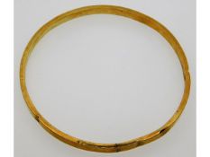 An antique 9ct gold bangle, internal diameter 76mm
