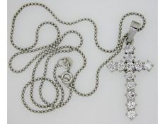 An 18ct white gold necklace with cross set with ap