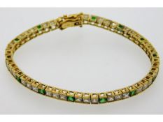 A gold plated silver bracelet set with white & gre