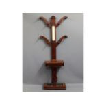 A Victorian mahogany hall tree with central mirror