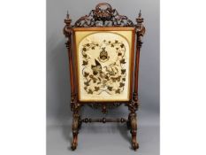 A large 19thC. rosewood ornate firescreen with rai