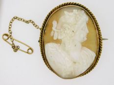 A yellow metal mounted cameo a/f, electronically t