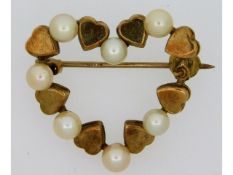 A Mikimoto 9ct gold heart shaped brooch with furth