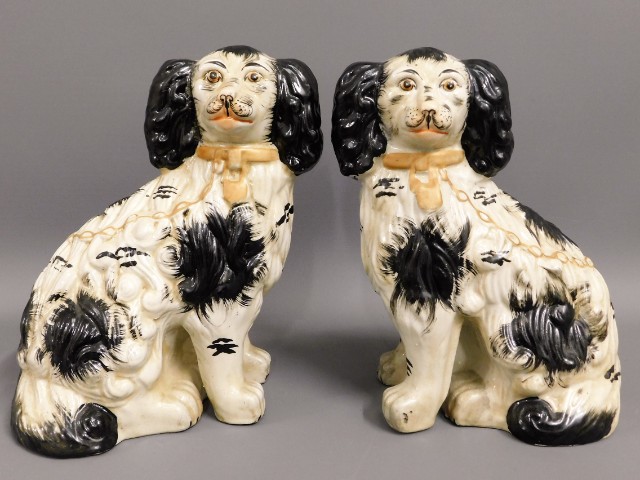 A pair of Victorian style "Staffordshire" spaniel dogs, 10in high