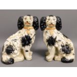 A pair of Victorian style "Staffordshire" spaniel dogs, 10in high