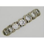 An 18ct yellow gold half eternity ring set with ap