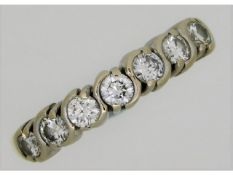 An 18ct yellow gold half eternity ring set with ap