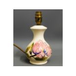 A Moorcroft pottery table lamp, 9in tall