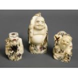 Three carved Japanese carved bone netsuke figures,