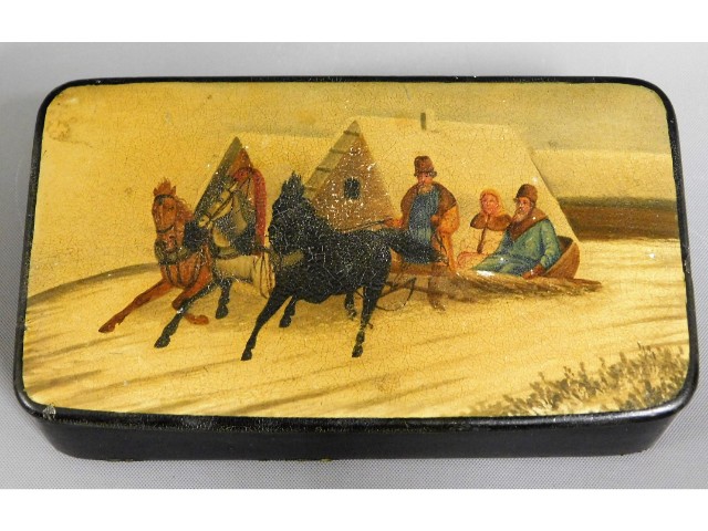 An antique Russian lacquerware snuff box with snow