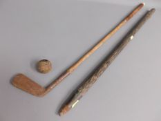 An early golf ball twinned with a hickory gold clu