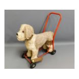 A vintage Lines Bros. ride/push along dog toy, eye