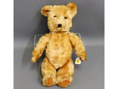 A mid 20thC. teddy bear, articulated arms & legs,