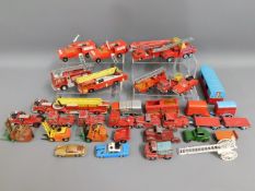 A quantity of vintage diecast fire engines & relat