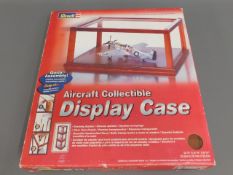 A boxed model aircraft display case