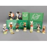 A Beswick nine piece pig promenade, five boxed, tw