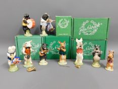 A Beswick nine piece pig promenade, five boxed, tw