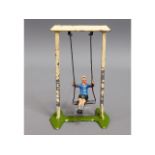 A diecast child on swing, probably Britains