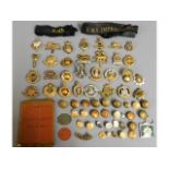 A quantity of military cap badges, buttons & tags