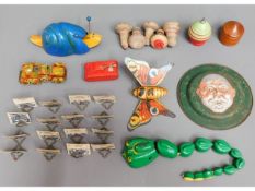 A collection of vintage toys including a tin plate