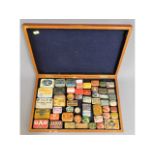 An oak cased collection of gramophone needle tins