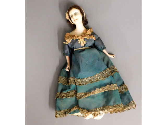 A 19thC. wax head doll, 11in tall