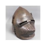 A 19thC. replica of a medieval knights helmet