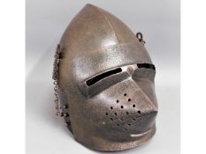 A 19thC. replica of a medieval knights helmet