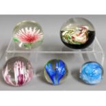 A quantity of glass paper weights including Liam C