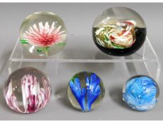 A quantity of glass paper weights including Liam C