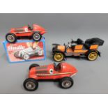 Three Schuco tinplate toy cars, one boxed, includi