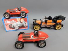 Three Schuco tinplate toy cars, one boxed, includi