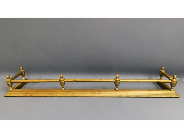 A brass fire fender, 53in x 11in deep