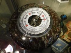 A Cornish serpentine mounted barometer, 7.25in dia