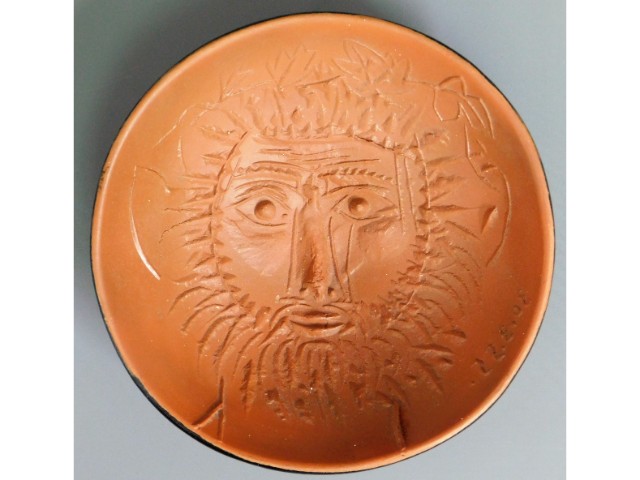 A Madoura Pablo Picasso earthenware bowl with heavy relief face decor & glazed outer body, maker mar