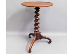 A 19thC. barley twist wine table with rosewood ped