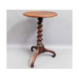 A 19thC. barley twist wine table with rosewood ped