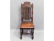 A c.1900 carved oak high backed hall chair, 44.5in