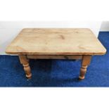 A stripped pine low level coffee table 36in wide x
