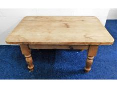 A stripped pine low level coffee table 36in wide x
