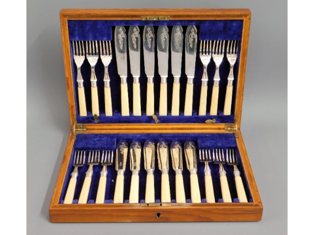 An oak James Dixon & Sons 24 piece silver plated f